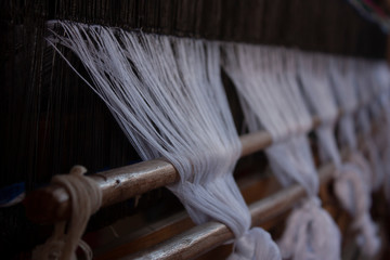  Yarns for weaving white garments mounted on a weaving machine in Mexico