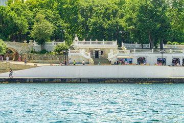 Fototapeta na wymiar View from the sea to the Kornilov embankment of the Sevastopol Bay
