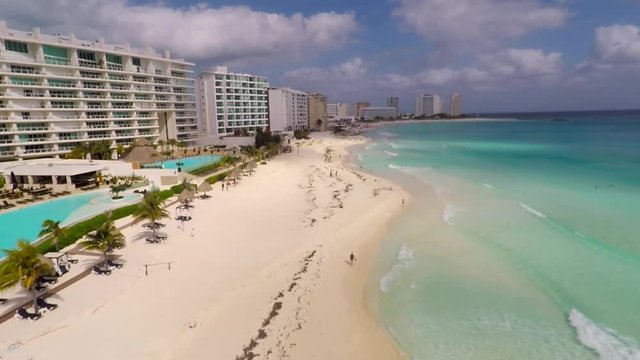 Aerial view on Chac Mool beach and turquoise water in Caribbean Sea. Resorts on Coast in Cancun, Mexico 