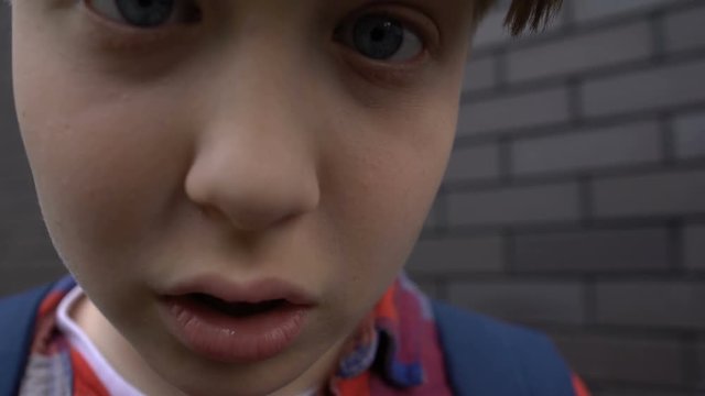 Teenage boy teasing, bullying into camera, provocation to fight, victim POV