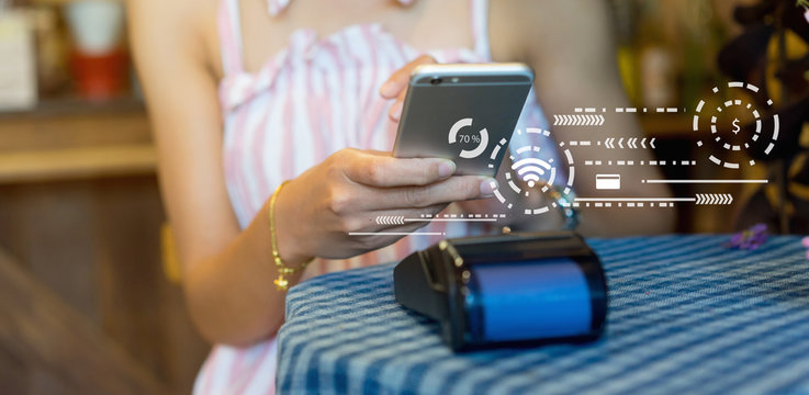 close up customer woman hand turn of wifi to connect using application phone for paying bill by payment machine , contactless payment concept	 - Powered by Adobe