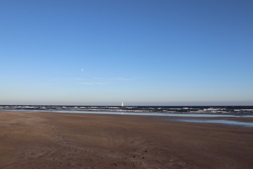 Sailing boat under the moon