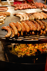 Large round barbecue of sausages and grilled meat