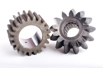 Small group of gears with their teeth engaged on a white background