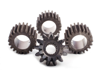 Small group of gears with their teeth engaged on a white background