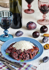Beef Bourguignon  with plums. beef with red wine and plums,  stewed second course. dish with meat.