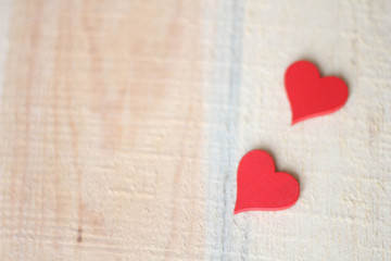Two Red Hearts on a wooden background