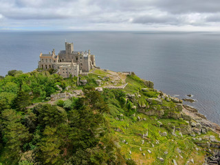 Fototapeta na wymiar Aerial view St Michael's Mount is a small tidal island in Mount's Bay, Cornwall, England, United Kingdom. Castle and chapel on the top of the mount. 