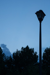 Blue night sky with lamp post and empty copy space for text