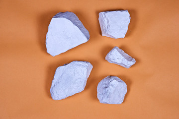 White stones on peach background