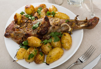 Grilled shoulder of mutton with baked new potatoes