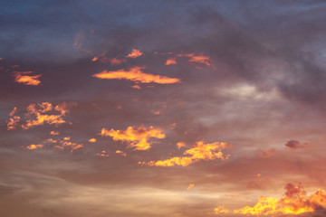 Bright Orange Clouds in a Purple Sky at Sunset