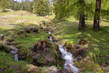 Panorama of untouched landscapes in the Austrian Alps with river, streams and waterfalls