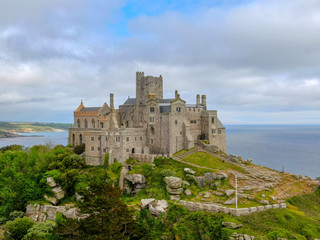 Fototapeta na wymiar Aerial view St Michael's Mount is a small tidal island in Mount's Bay, Cornwall, England, United Kingdom. Castle and chapel on the top of the mount. 