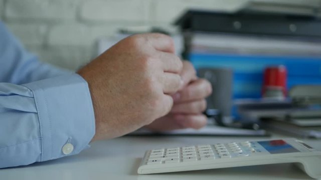 Bored Businessman Playing Restless with a Pen in Hands and Waiting in Office