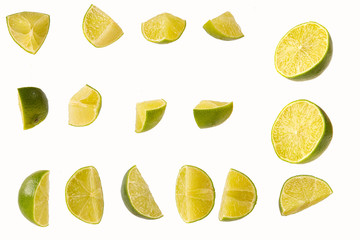 slices of cut lime isolated on white background
