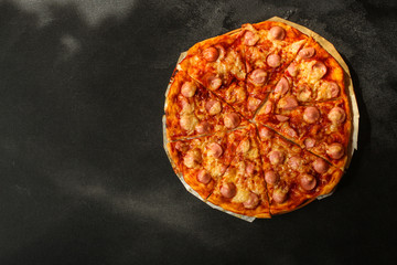 pizza with sausages (tomato sauce, cheese, meat). food background. top view. copy space