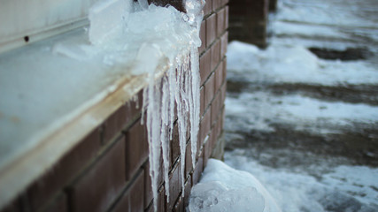 icicles on brick wall background