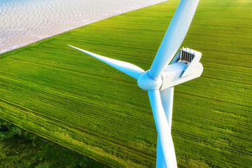 Wind power station on the field. Aerial view from drone. Concept and idea of alternative energy...