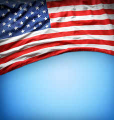 Obraz premium American flag on blue background. Copy space