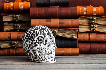 skull on the leather journal book background