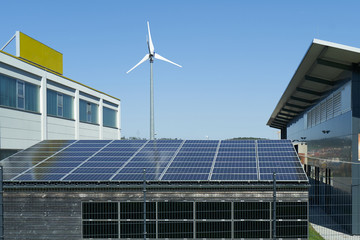 Solar panels installed on the roof, against the background of a blue sky. Green technology