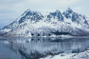 Obraz na płótnie Canvas Beautiful panoramic winter view of Austnesfjorden, Sildpollen bay, Austvagoya island, Vagan Municipality, Nordland, Lofoten Islands, Norway, with fjord and mountains