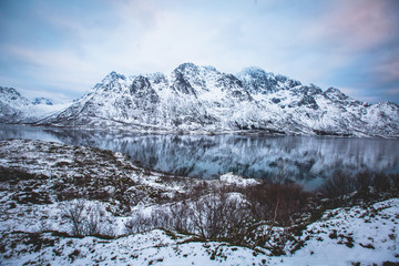 Fototapeta na wymiar Beautiful panoramic winter view of Austnesfjorden, Sildpollen bay, Austvagoya island, Vagan Municipality, Nordland, Lofoten Islands, Norway, with fjord and mountains