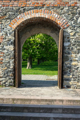Castle wooden door leading to garden