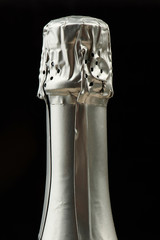 Fototapeta na wymiar Tall champagne silver bottle head
