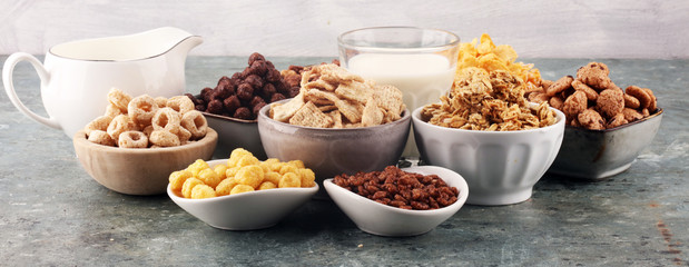 Cereal. Bowls of various cereals and milk for breakfast. Muesli with kids cereals.