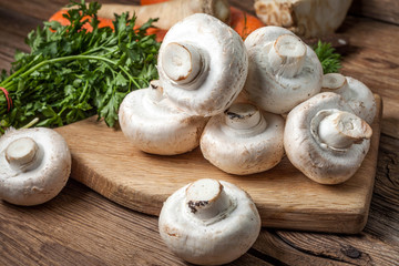 Fresh mushrooms on cutting board.