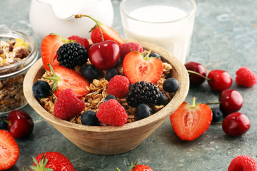 Cereal. Bowl of granola cereals, fruits and milk for breakfast. Muesli with cereals.
