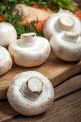 Fresh mushrooms on cutting board.
