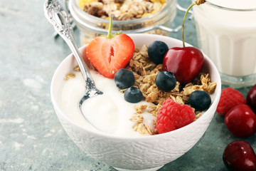 Cereal. Bowl of granola cereals, fruits and milk for breakfast. Muesli with cereals.