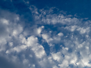 Deep blue sky and white clouds. Day sky in an ecologically clean area with a beautiful view of the clouds. Natural view of nature.