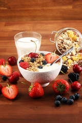 Cereal. Bowl of granola cereals, fruits and milk for breakfast. Muesli with cereals.