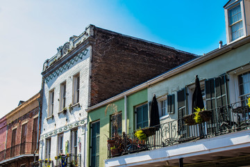 Obraz premium Traditional Brick Colonial Buildings with Beautiful Balconies overlook the French Market Area in New Orleans, Louisiana, USA