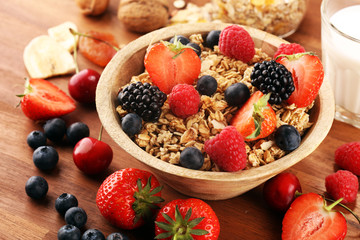 Cereal. Bowl of granola cereals, fruits and milk for breakfast. Muesli with cereals.