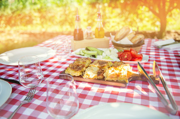 Table is set and waiting for dining in the countryside