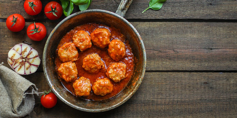 meatballs in tomato sauce (meat dish). food background. top view. copy space