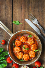 meatballs in tomato sauce (meat dish). food background. top view. copy space
