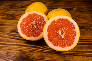 Ripe juicy grapefruit on a wooden table