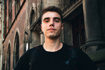 Close up of a young European guy looking straight into the lens