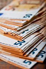 Pile of fifty euro banknotes. 50€ currency notes stacked. Money bank finance business concept.