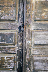 old wood rustic door with rust chain and lock