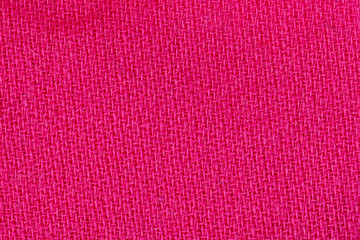 Pink fabric background texture. Detail of textile material close-up