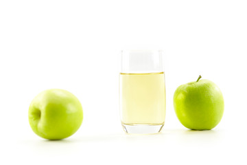 two apples and a glass of apple juice