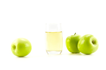 three apples and a glass of apple juice