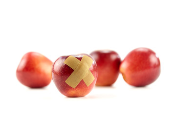 red apple with bandage
